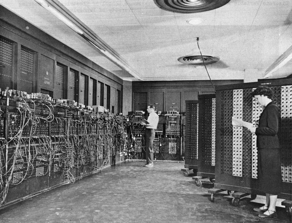 The ENIAC (Electronic Numerical Integrator and Computer), one of the world's first general-purpose computers, with operators working at control panels, 1946