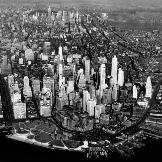Black and white photograph of the New York City skyline taken in 1931, showing early skyscrapers including the Empire State Building under construction